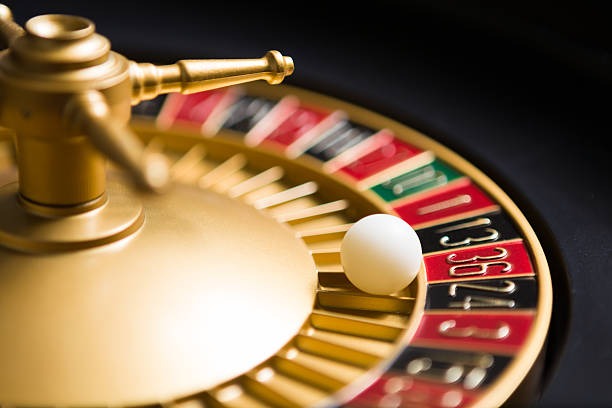 Dealer spinning the American Roulette wheel during live gameplay